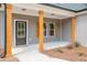 Covered front porch featuring wood columns and trim, adding character to this lovely home at 121 Hunters Ln, Powder Springs, GA 30127