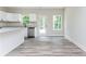 Bright kitchen with stainless steel appliances, granite countertops and white cabinetry at 121 Hunters Ln, Powder Springs, GA 30127