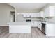 Bright kitchen with white cabinets, stainless steel appliances, and granite countertops at 121 Hunters Ln, Powder Springs, GA 30127