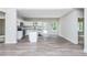Open concept kitchen featuring an island, white cabinets and stainless steel appliances at 121 Hunters Ln, Powder Springs, GA 30127