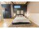 Modern bedroom features a platform bed, decorative wall art, with an industrial minimalist design at 1661 La France St # 102, Atlanta, GA 30307