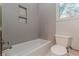 Clean bathroom featuring a bathtub and updated tile at 2454 Field Way, Brookhaven, GA 30319