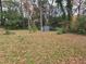 Large backyard with a shed and plenty of trees at 2842 Delowe Dr, Atlanta, GA 30344