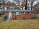 Brick ranch home with a well-maintained lawn at 2842 Delowe Dr, Atlanta, GA 30344
