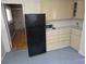 Clean kitchen with refrigerator and microwave at 2842 Delowe Dr, Atlanta, GA 30344