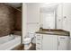 Modern bathroom with a soaking tub, granite vanity, and tile shower at 270 17Th Nw St # 809, Atlanta, GA 30363