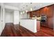 Modern kitchen with hardwood floors, stainless steel appliances, and dark wood cabinets at 270 17Th Nw St # 809, Atlanta, GA 30363