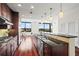 Modern kitchen with granite countertops, stainless steel appliances, and dark wood cabinets at 270 17Th Nw St # 809, Atlanta, GA 30363