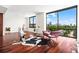 Bright living room with hardwood floors, city views, and stylish furniture at 270 17Th Nw St # 809, Atlanta, GA 30363