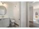 Small bathroom with white vanity and shiplap walls at 56 Veranda Walk, Dallas, GA 30157
