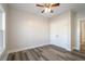 Simple bedroom with hardwood floors and double doors at 56 Veranda Walk, Dallas, GA 30157