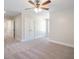 Bright bedroom featuring a ceiling fan and ample closet space at 56 Veranda Walk, Dallas, GA 30157