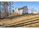 Exterior view of two story house with backyard at 56 Veranda Walk, Dallas, GA 30157
