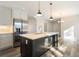 Kitchen island with stainless steel appliances and white cabinets at 56 Veranda Walk, Dallas, GA 30157