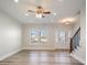 Spacious living room with hardwood floors, a ceiling fan, and lots of natural light at 56 Veranda Walk, Dallas, GA 30157