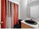 Bathroom with black sink, toilet and washer and dryer in the closet at 6977 Gallant Se Cir # 8, Mableton, GA 30126