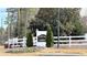 Parkview Commons community sign surrounded by a white fence and greenery, creating a welcoming entrance at 6977 Gallant Se Cir # 8, Mableton, GA 30126