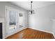 Bright dining room with hardwood floors and sliding glass doors leading to a patio at 6977 Gallant Se Cir # 8, Mableton, GA 30126