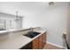 Kitchen features double sink, wood cabinets, and neutral countertops at 6977 Gallant Se Cir # 8, Mableton, GA 30126