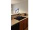 Kitchen features a double sink and wood cabinets at 6977 Gallant Se Cir # 8, Mableton, GA 30126