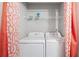 Laundry closet with washer and dryer and shelving at 6977 Gallant Se Cir # 8, Mableton, GA 30126