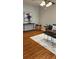 Living room with a brown leather couch and wood floors at 6977 Gallant Se Cir # 8, Mableton, GA 30126