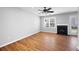 Spacious living room featuring hardwood floors, fireplace, and sliding glass doors at 6977 Gallant Se Cir # 8, Mableton, GA 30126