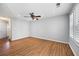 Large living room with hardwood floors, ceiling fan and lots of natural light at 6977 Gallant Se Cir # 8, Mableton, GA 30126