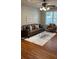 Living room with a brown leather couch and wood floors at 6977 Gallant Se Cir # 8, Mableton, GA 30126