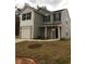 Two-story house featuring a gray exterior, white accents, and a two-car garage at 1188 To Lani Path, Stone Mountain, GA 30083
