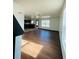 Spacious living room with hardwood floors and access to the kitchen at 1188 To Lani Path, Stone Mountain, GA 30083