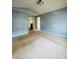 Large main bedroom with blue walls and carpeted floors at 1188 To Lani Path, Stone Mountain, GA 30083