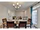 Bright dining room with hardwood floors and chandelier at 3950 Oxford Park Ln, Cumming, GA 30040