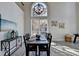 Bright dining room with hardwood floors and large windows at 11675 Red Maple Forest Dr, Alpharetta, GA 30005