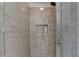 Modern shower with glass enclosure and neutral tile at 11675 Red Maple Forest Dr, Alpharetta, GA 30005