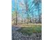 Wooded backyard with a grassy area at 2884 Norfair Loop, Lithonia, GA 30038