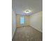 Well-lit bedroom with carpeted floor and window at 2884 Norfair Loop, Lithonia, GA 30038