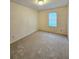 Bright bedroom with carpeted floor and a window at 2884 Norfair Loop, Lithonia, GA 30038