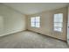 Spacious carpeted bedroom with large windows at 2884 Norfair Loop, Lithonia, GA 30038