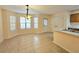 Bright dining area with tile floors, bay window, and access to kitchen at 2884 Norfair Loop, Lithonia, GA 30038