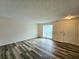 Bright living room featuring vinyl flooring and a view of the patio at 2884 Norfair Loop, Lithonia, GA 30038