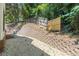 Side yard with retaining wall, gravel, and wooden fence at 630 Darlington Commons Ne Ct, Atlanta, GA 30305