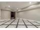 Finished basement room with marble flooring and access to other rooms at 630 Darlington Commons Ne Ct, Atlanta, GA 30305