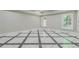 Finished basement room with marble flooring and large windows at 630 Darlington Commons Ne Ct, Atlanta, GA 30305