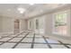 Finished basement with marble tile floors and french doors at 630 Darlington Commons Ne Ct, Atlanta, GA 30305