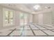 Finished basement with marble tile floors and french doors at 630 Darlington Commons Ne Ct, Atlanta, GA 30305
