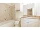 Clean bathroom with white cabinets and beige tile at 630 Darlington Commons Ne Ct, Atlanta, GA 30305