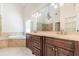 Bathroom boasts double vanity and a large soaking tub at 630 Darlington Commons Ne Ct, Atlanta, GA 30305