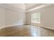 Bright bedroom with hardwood floors and large window at 630 Darlington Commons Ne Ct, Atlanta, GA 30305