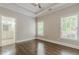 Bedroom with hardwood floors, ensuite bathroom and walk-in closet at 630 Darlington Commons Ne Ct, Atlanta, GA 30305